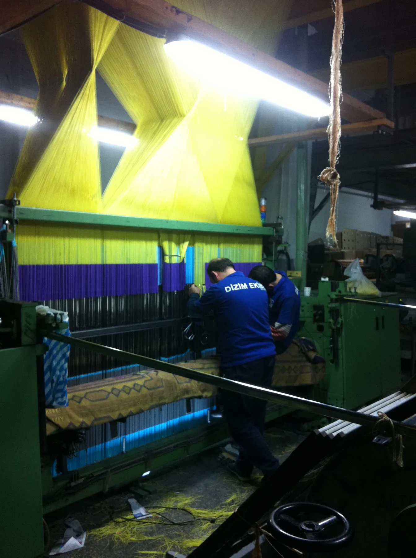 Harness team working on a jacquard loom
